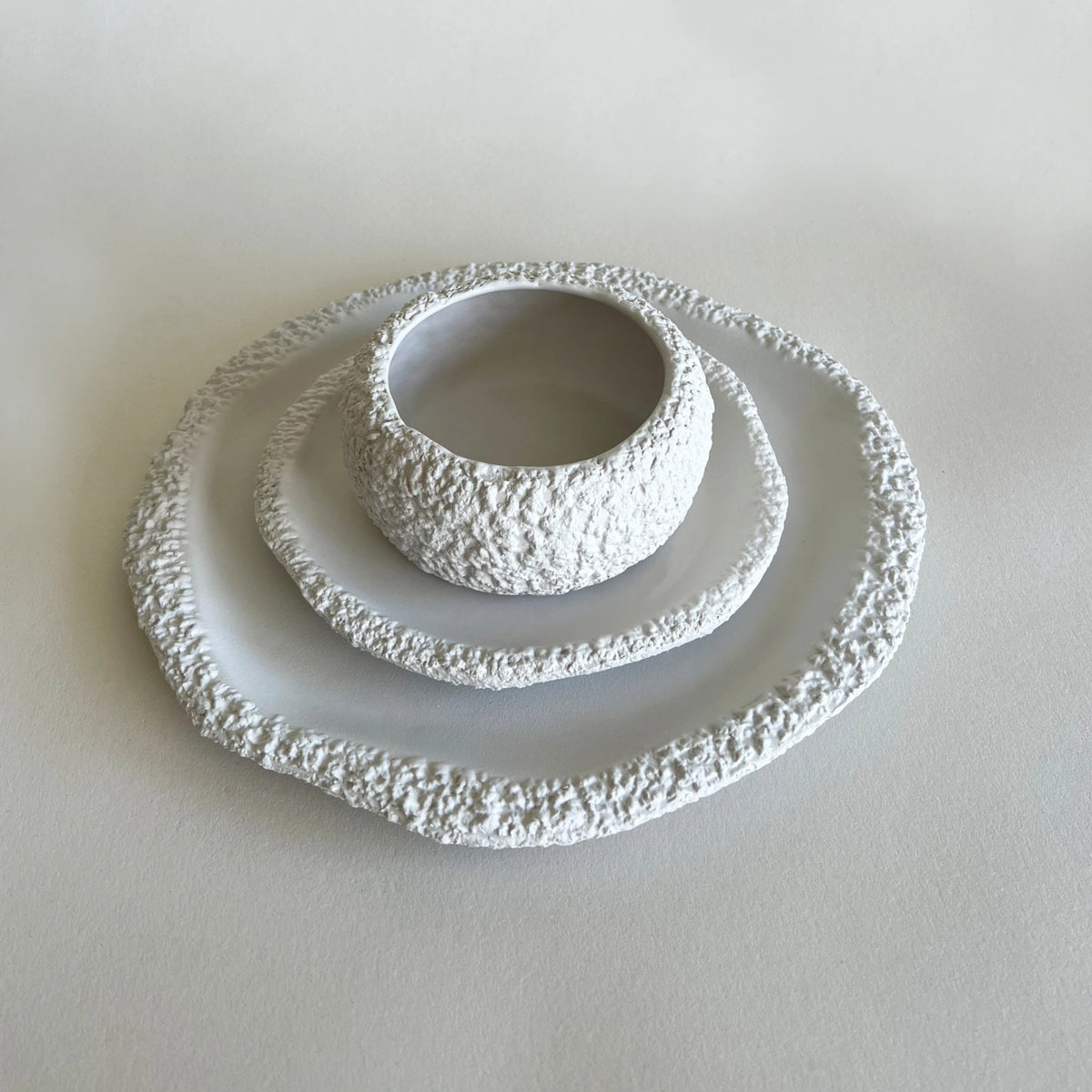 large and dessert raw textured white ceramic plates with matching soup bowl