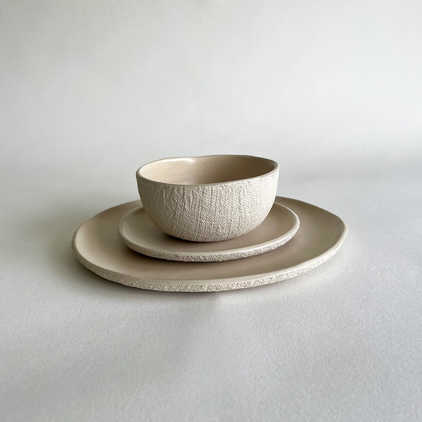 beige matte handmade ceramic tableware set of large plate, small plate, bowl
