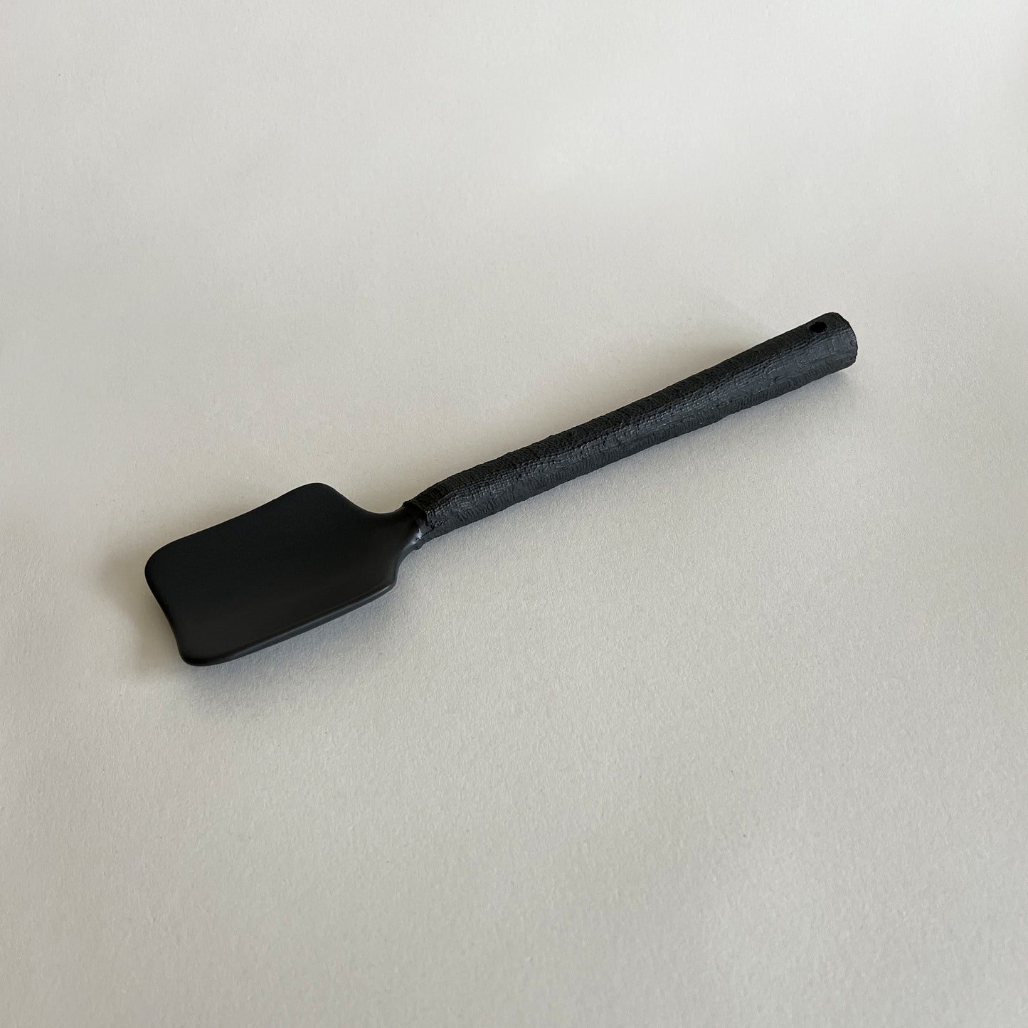 black matte textured handmade ceramic salad serving spoon