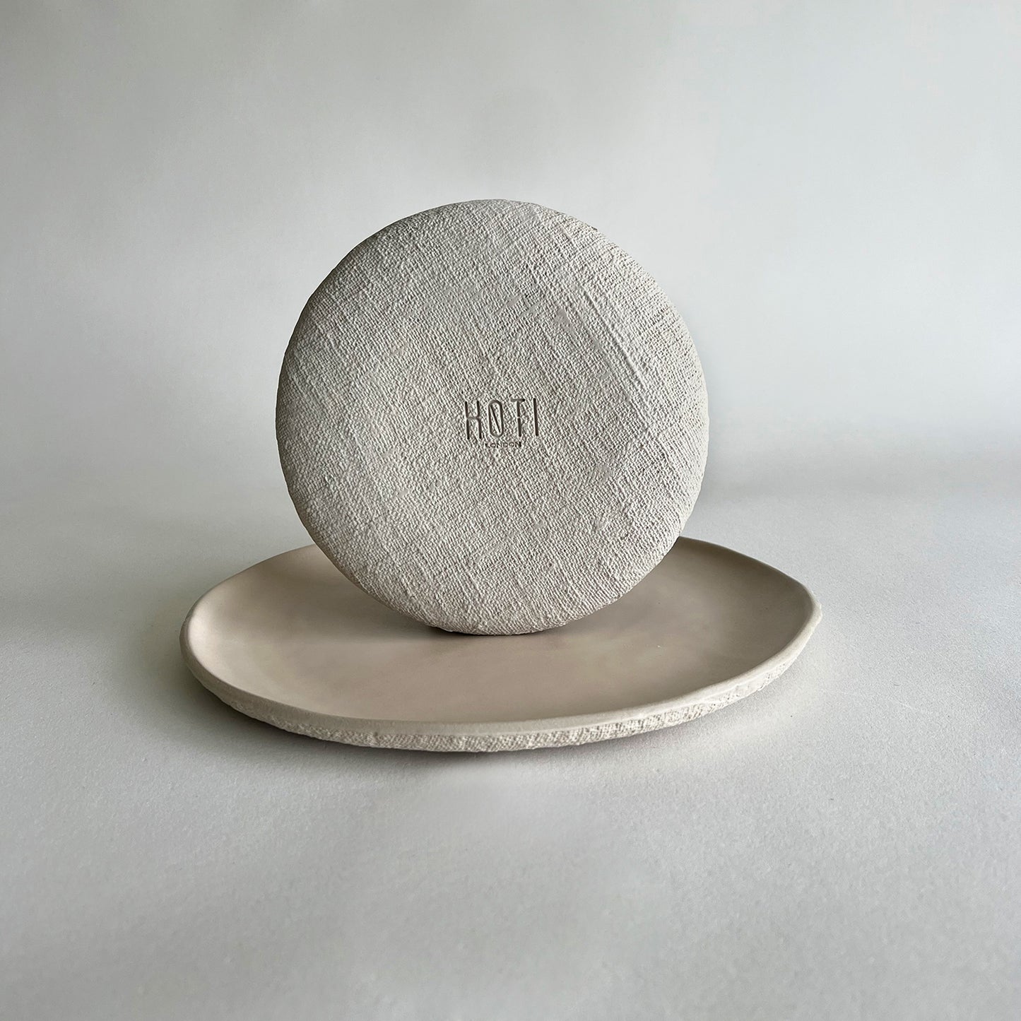 beige matte textured handmade ceramic set of plates