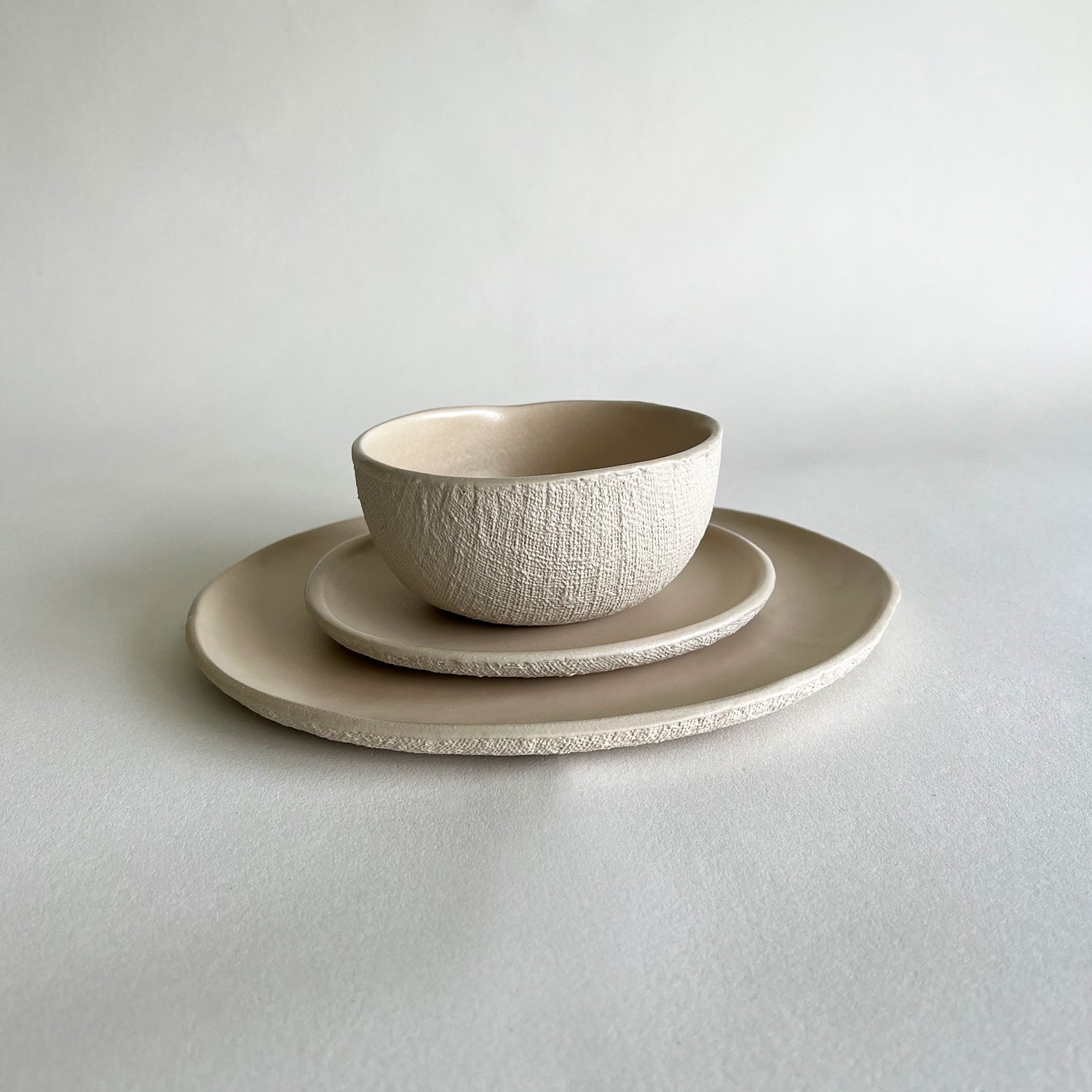 beige matte textured handmade dinnerware set of large dinner plate, small starter plate, dessert plate, soup bowl, breakfast bowl