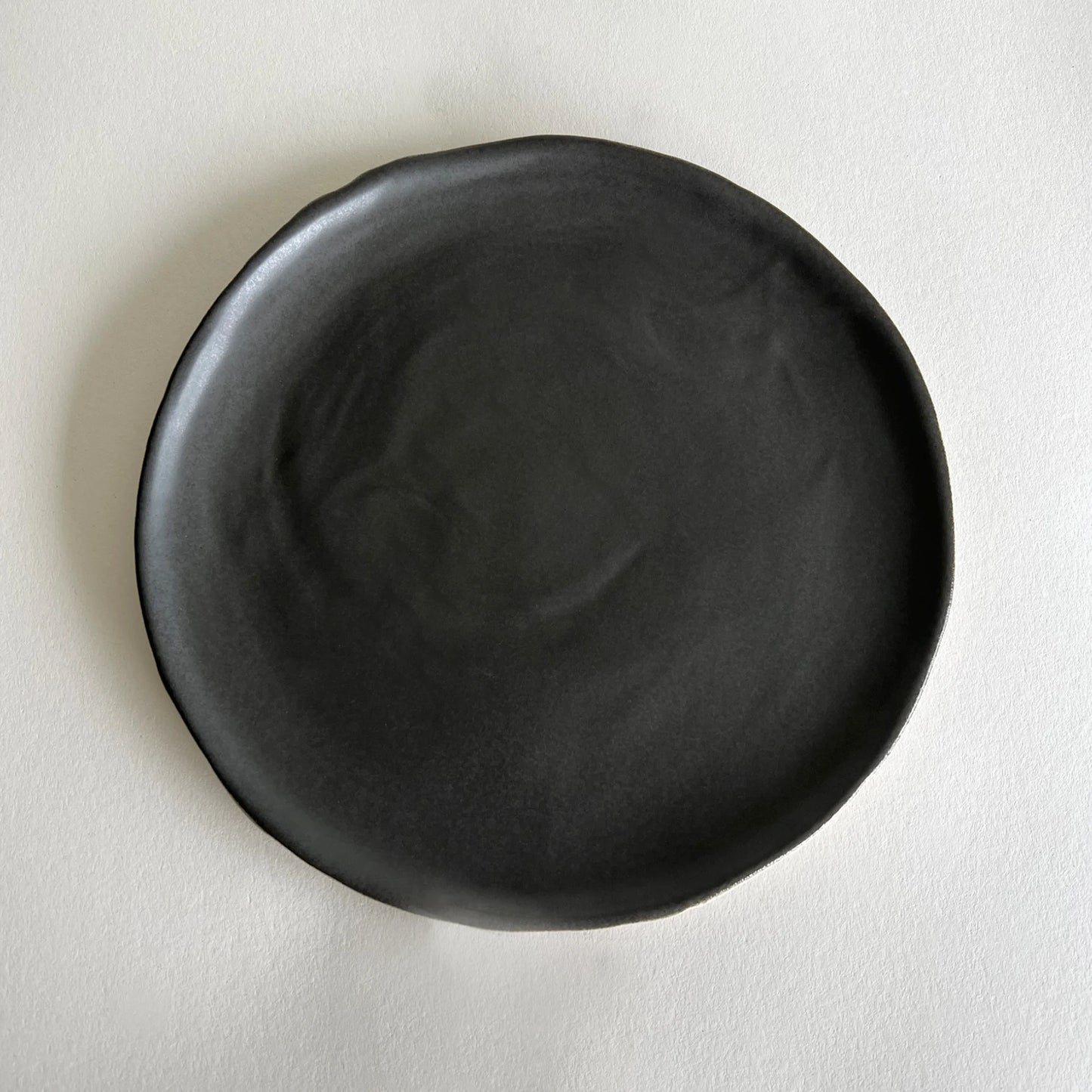 Matte charcoal handmade ceramic large dinner plate.