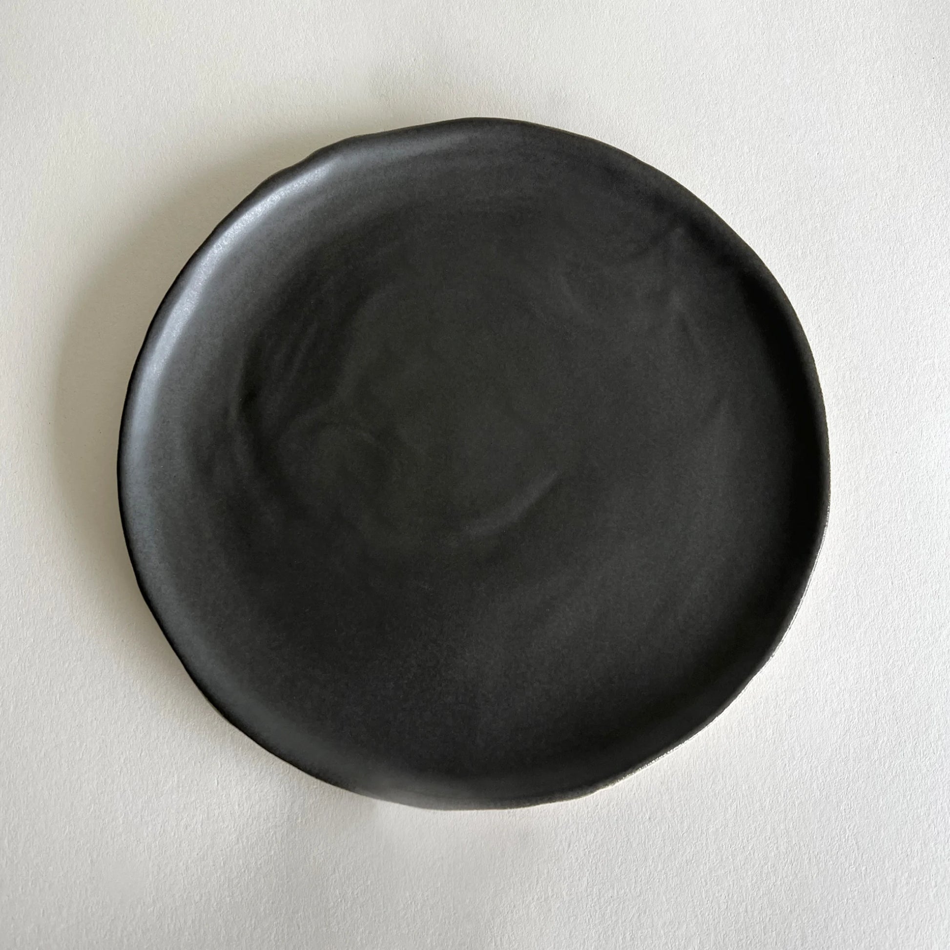 Matte charcoal handmade ceramic large dinner plate.