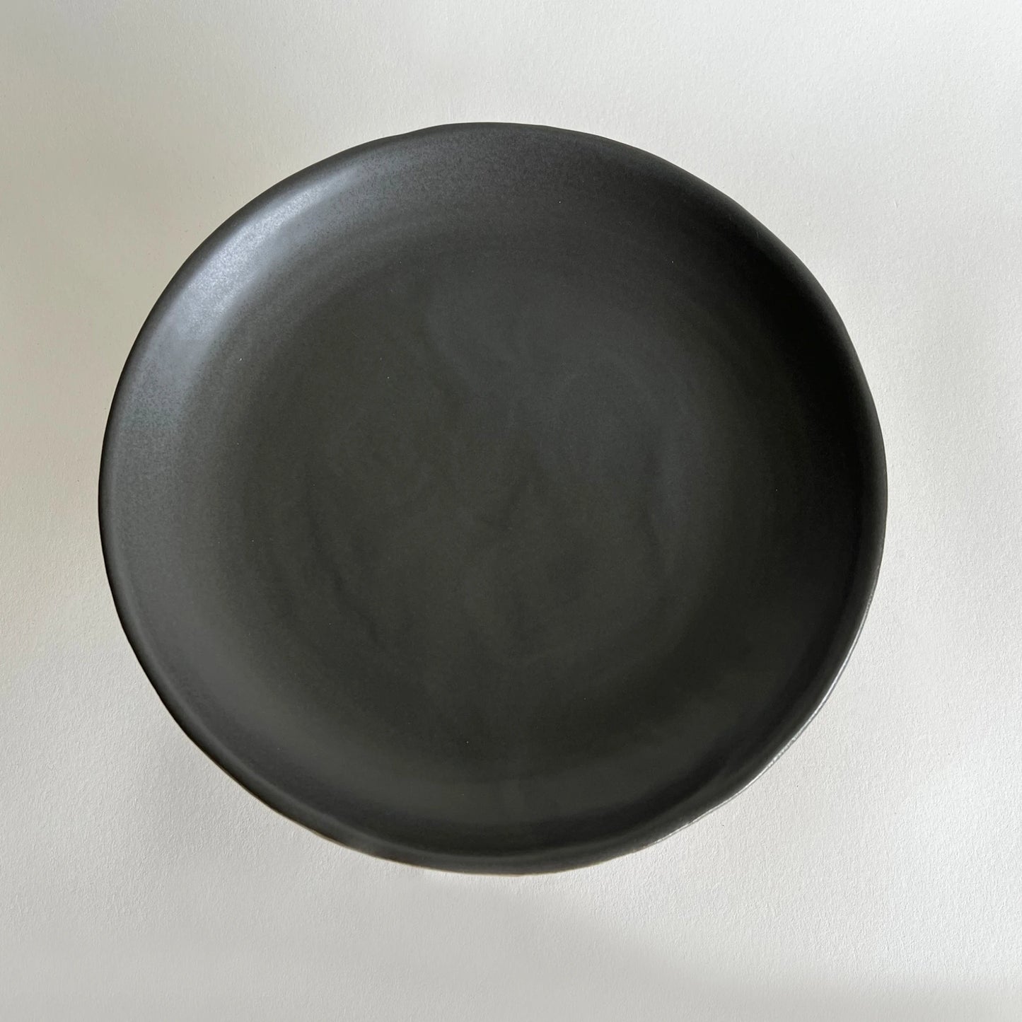 Large matte charcoal ceramic handmade serving platter.