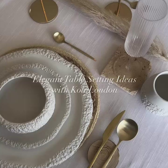 elegant table setting with white ceramic textured tableware set