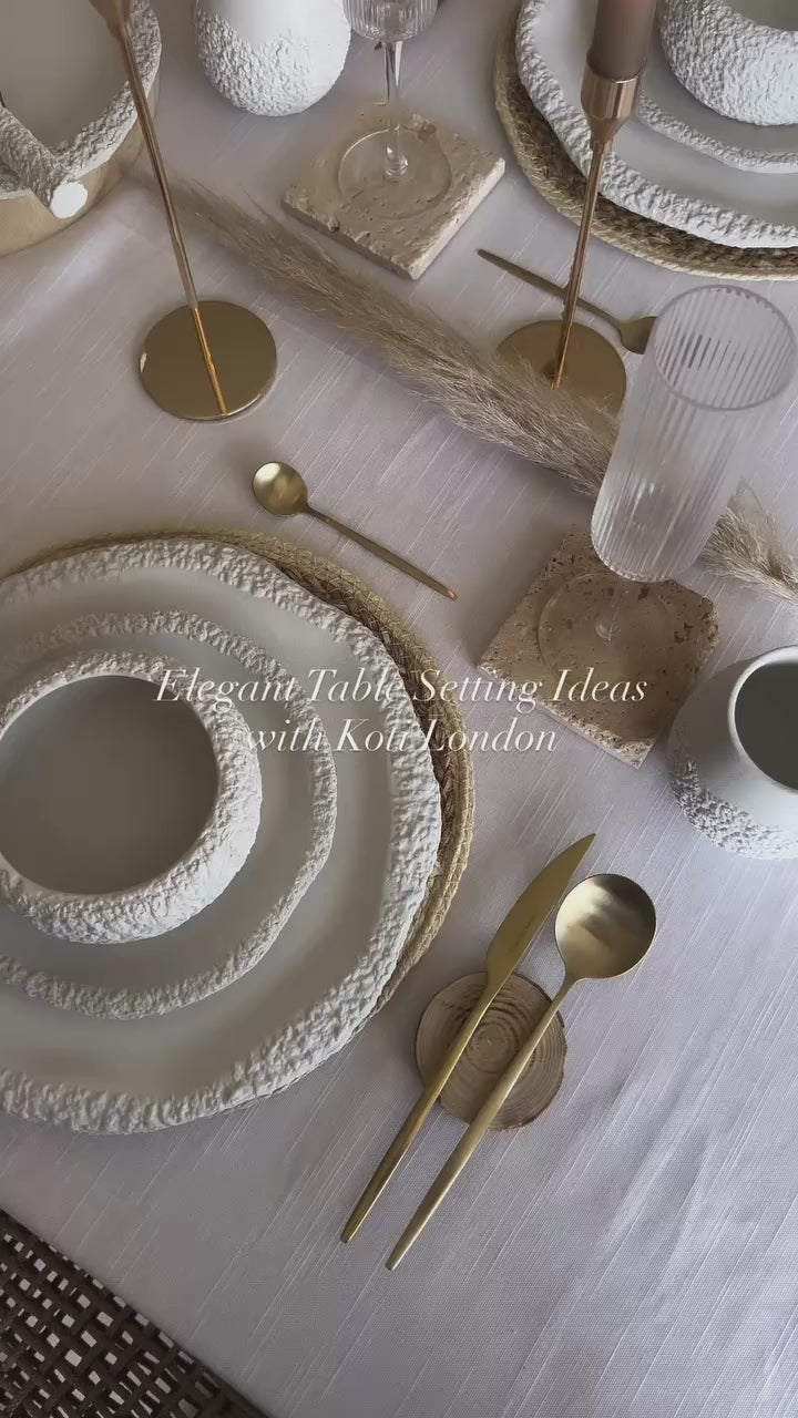 elegant table setting with white ceramic textured tableware set